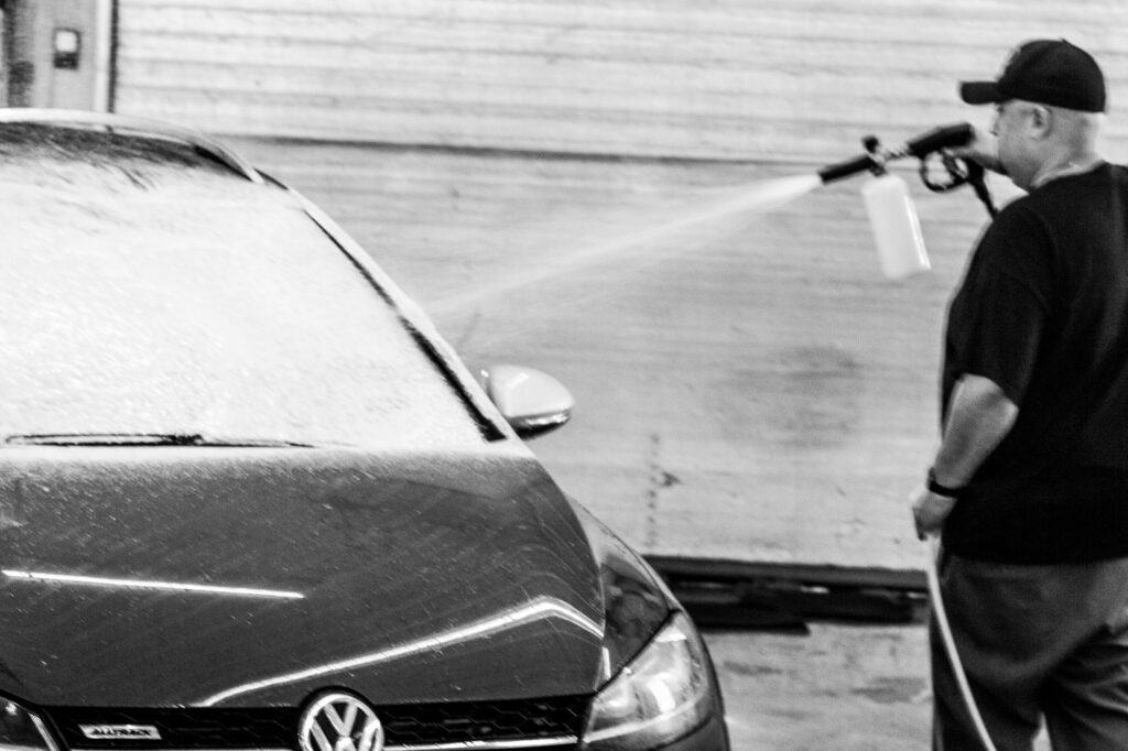 Applying soap foam on auto