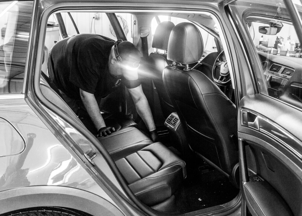 Vacuuming front of car to back